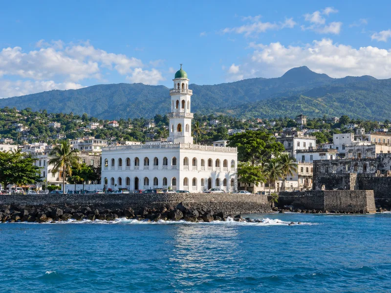 Illustrative Moroni coastal cityscape; not company premises
